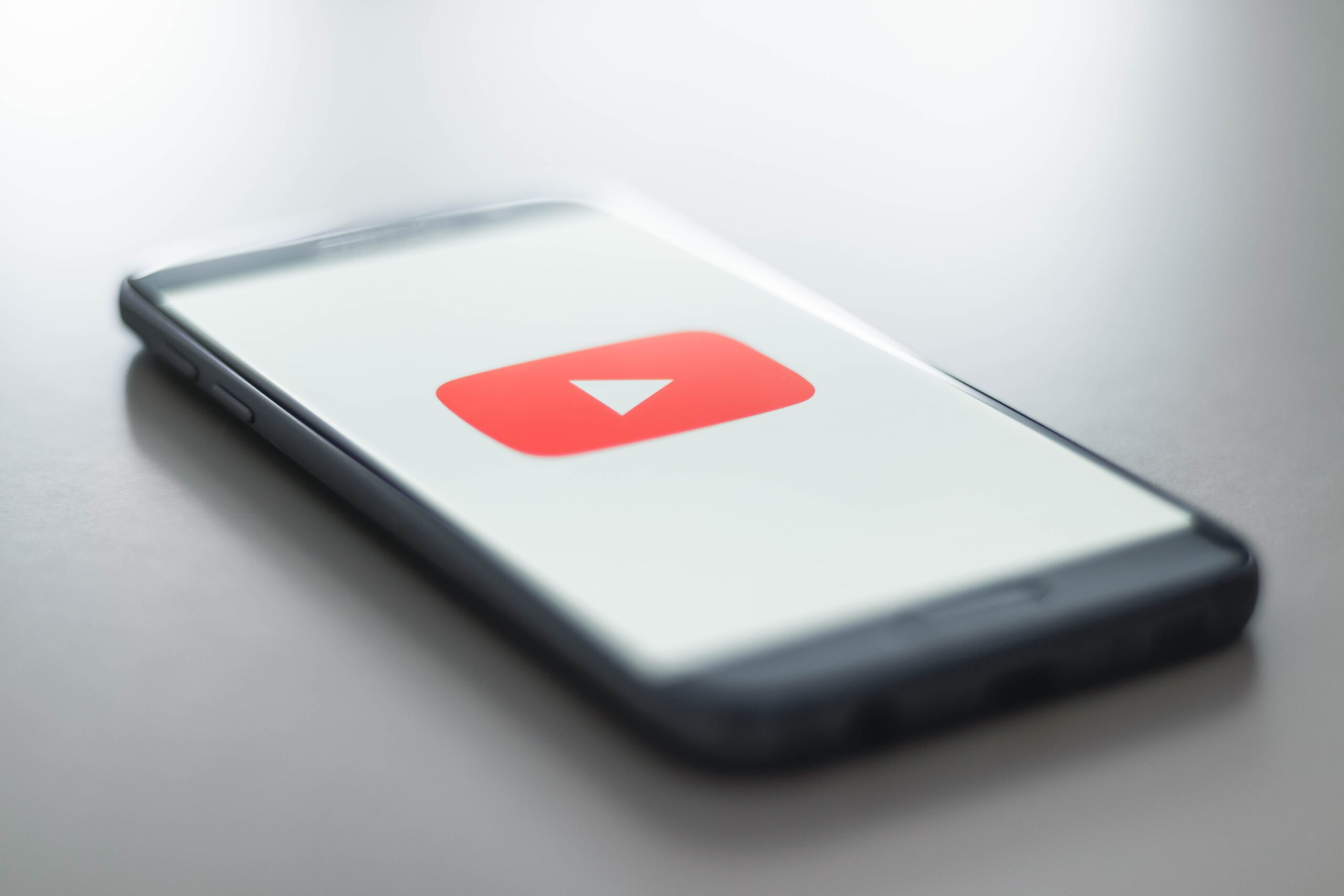 iPhone with YouTube logo